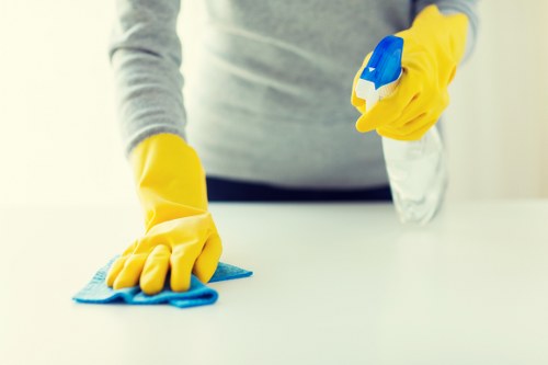 Carpet cleaning technician preparing equipment before a booked service