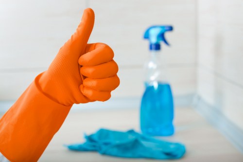 Worker handling cleaning equipment safely